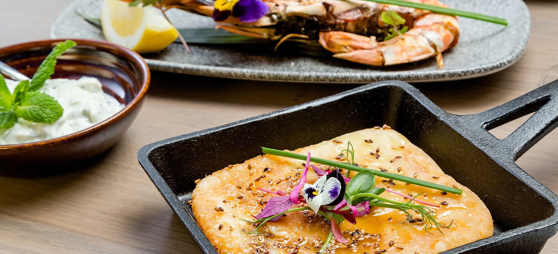 Pan fried cheese, toasted sesame, a thread of honey.