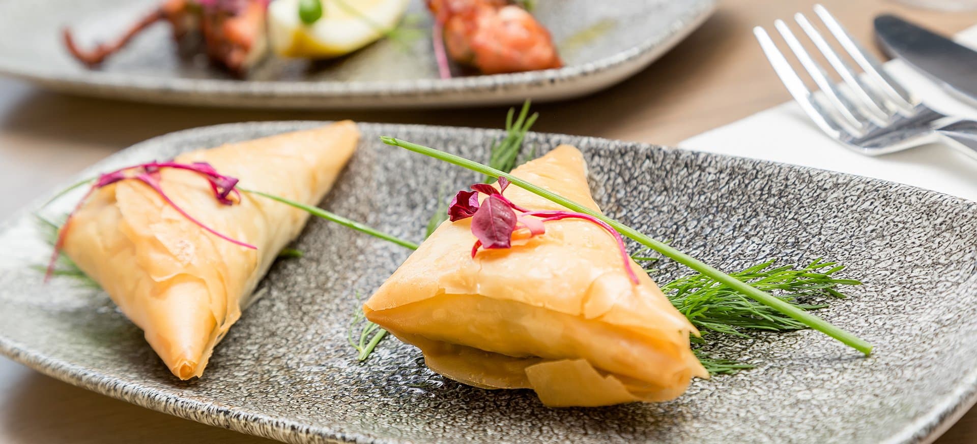 Spinach and feta folded into filo, crisp at the edges.